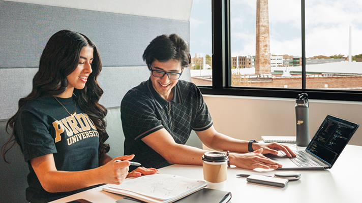 Two Purdue University students collaborating